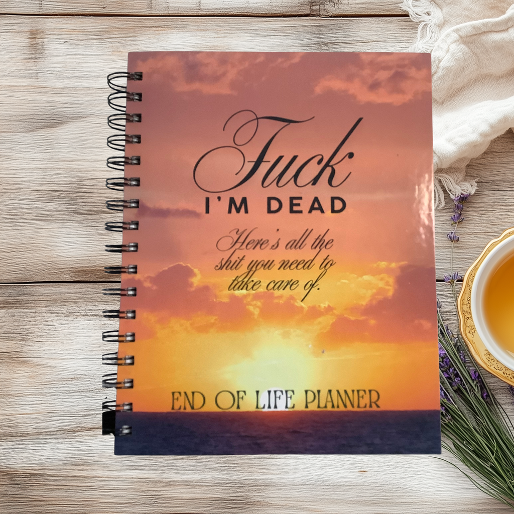 Spiral-bound end-of-life planner with an orange sunset cover reading “Fuck, I’m dead. Here’s all the shit you need to take care of.”