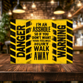 Distressed yellow and black aluminum sign with hazard stripes, reading “Danger,” “Warning” and “I’m an asshole, so if you don’t want your feelings hurt, walk away.”