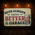 Distressed cream aluminum sign reading “Beer always tastes better in the garage,” with a foaming beer mug labelled “The best beer is an open beer.”