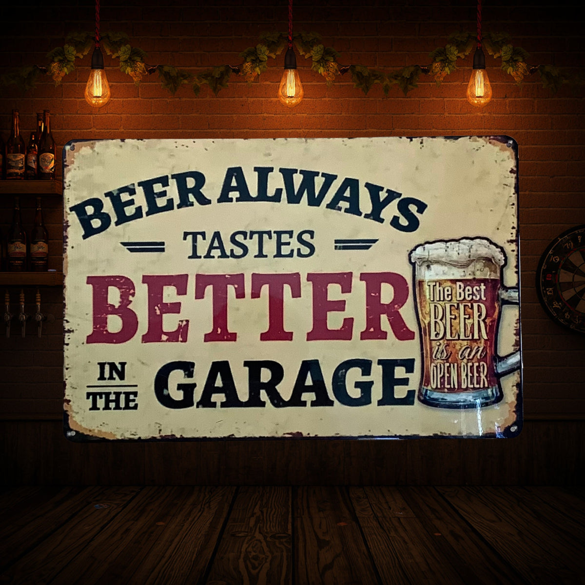 Distressed cream aluminum sign reading “Beer always tastes better in the garage,” with a foaming beer mug labelled “The best beer is an open beer.”
