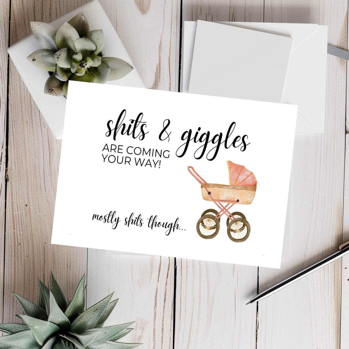 White rectangular new baby card with a pink vintage pram, reading “Shits & giggles are coming your way! Mostly shits though...”