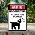 Black and white aluminum sign with a red “Warning” header and barking dog silhouette, reading “No soliciting. See dog for details!”