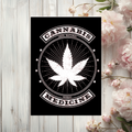 Black aluminum sign with a white cannabis leaf, radiating lines and stars, with lettering reading “Cannabis,” “100% natural” and “Herbal medicine.”