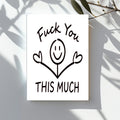 White rectangular card with a smiling stick figure holding both middle fingers up, reading “Fuck You This Much.”