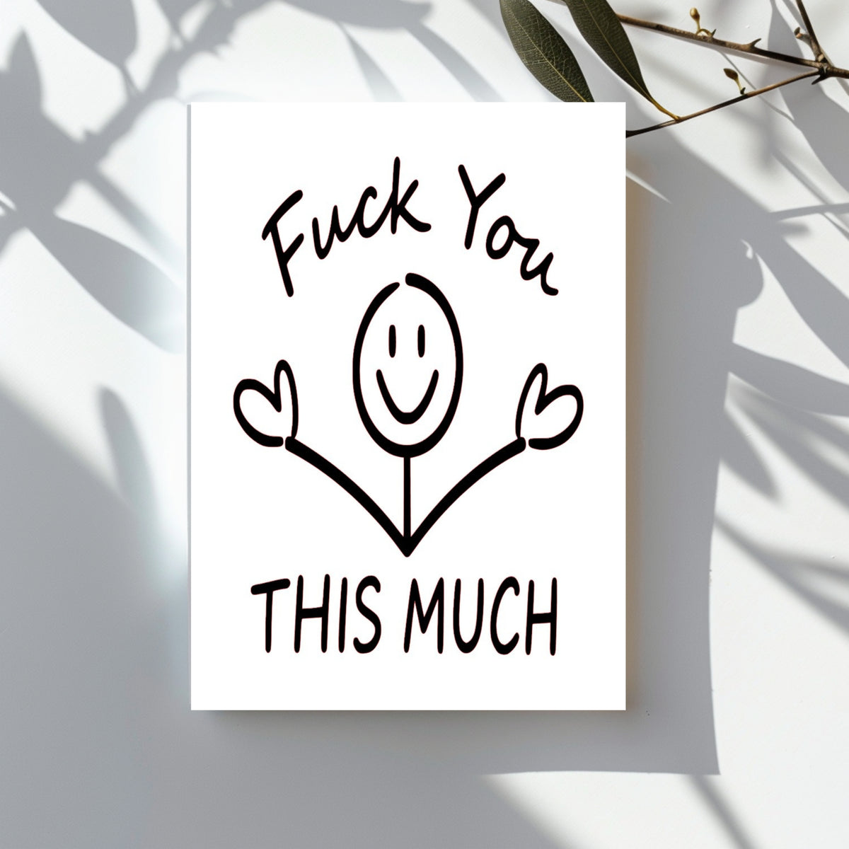 White rectangular card with a smiling stick figure holding both middle fingers up, reading “Fuck You This Much.”