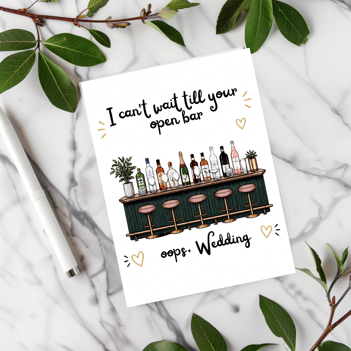 White rectangular wedding card with an illustrated bar, bottles and pink stools, reading “I can’t wait till your open bar” and “oops, Wedding.”