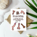 White rectangular birthday card with cartoon penises surrounding the words “For your birthday I drew all of your favorite things.”