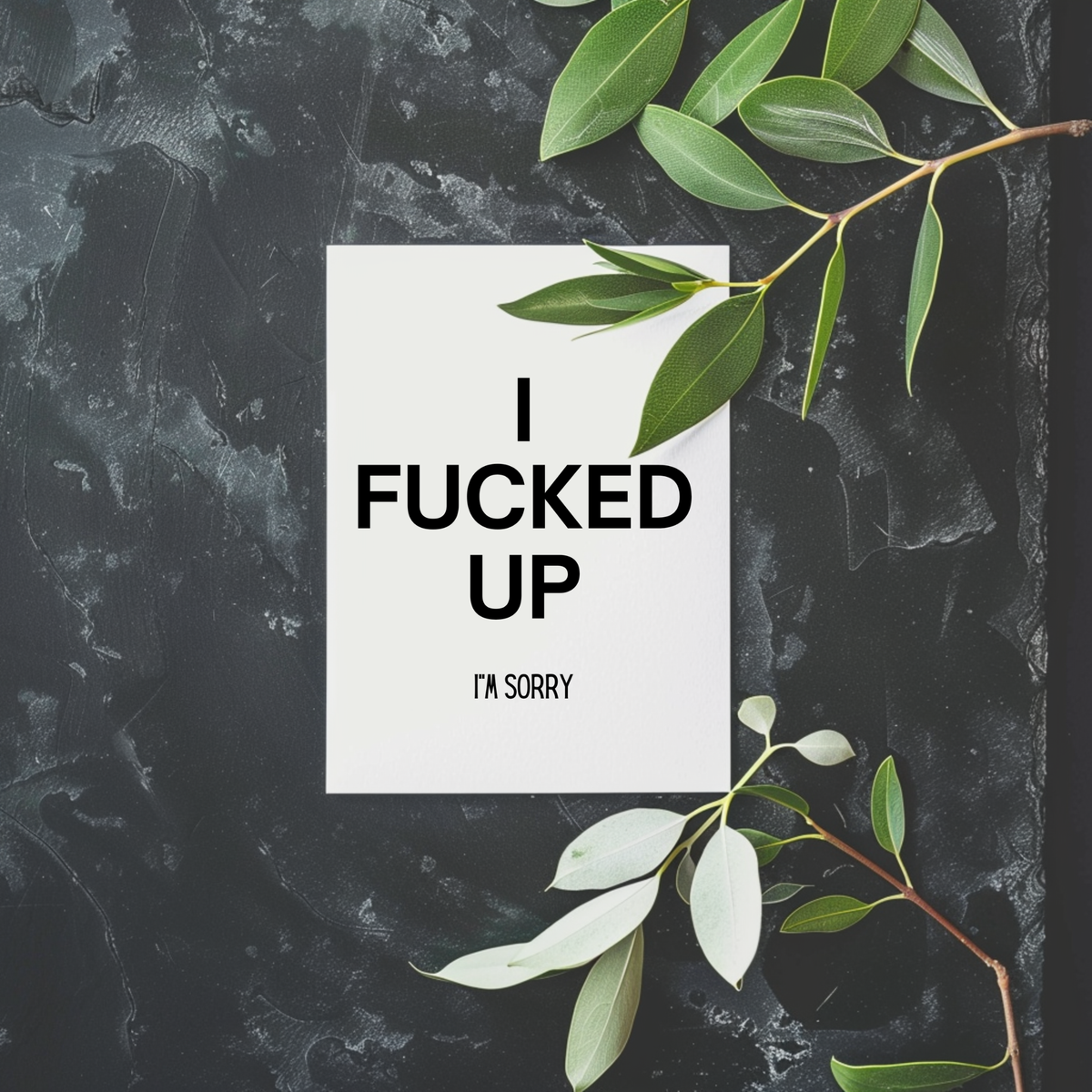 White rectangular apology card with large black lettering reading “I Fucked Up” and smaller text underneath reading “I’m Sorry.”