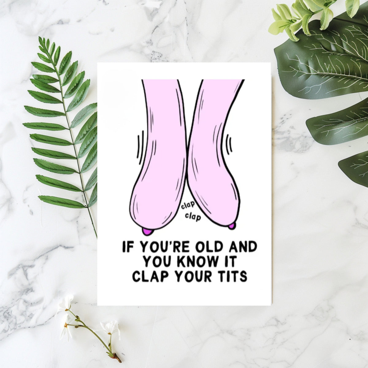 White rectangular card with cartoon pink breasts clapping together and the words “If you’re old and you know it clap your tits.”