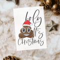 White rectangular card reading “Holy [poop] It’s Christmas,” with a smiling poop character wearing a Santa hat replacing “shit.”